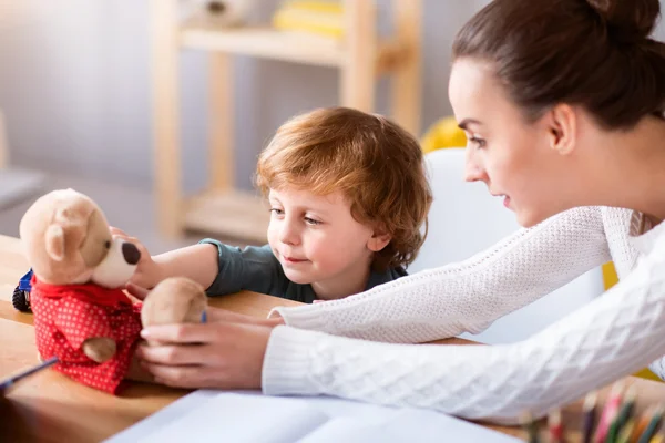 Woman and child sitting at the table — Stock Photo, Image