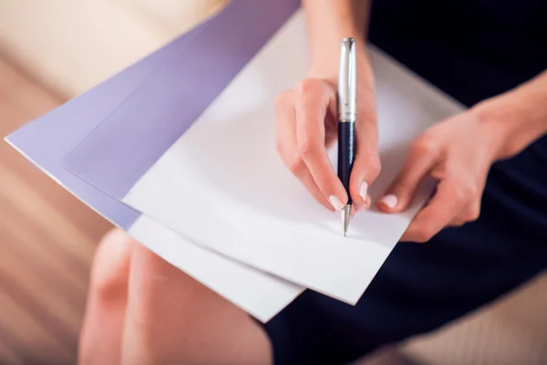 Close up of hands wring on paper — Stock Photo, Image