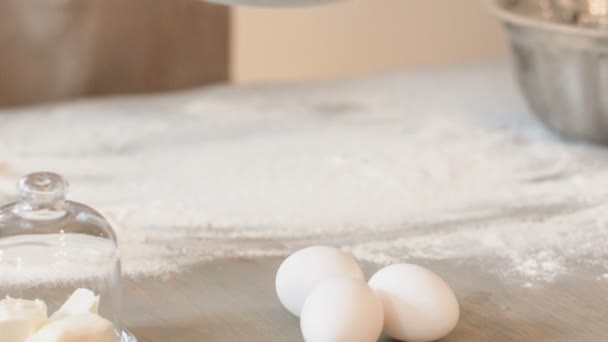 Pleasant baker sifting flour — Stock Video