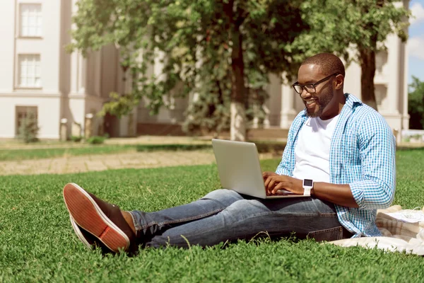 Joyful man using laptop — Stock Photo, Image