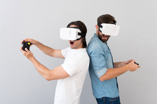 Positive men using virtual reality device