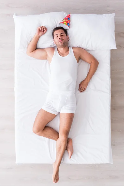 Nice young man relaxing on bed