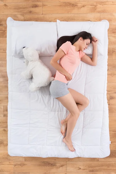 Lovely young woman sleeping on bed