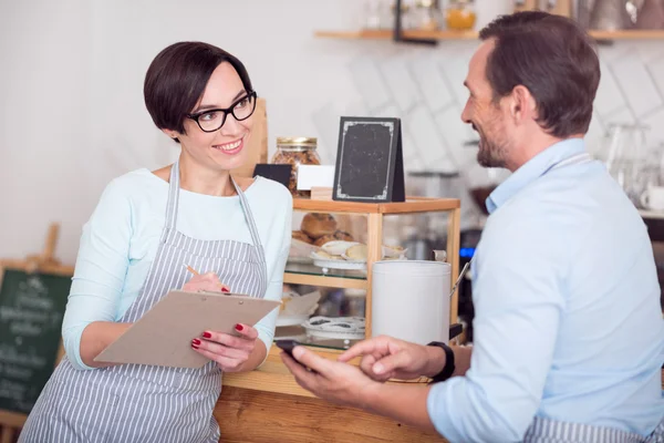 Two waiters in aprons working in cafe — Stock Photo, Image