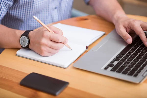 Nice man writing something down Stock Image