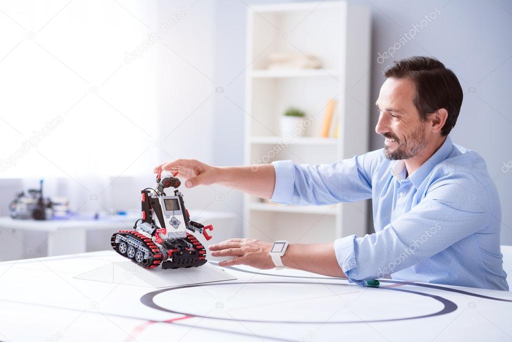 Enthusiastic engineer working in his laboratory