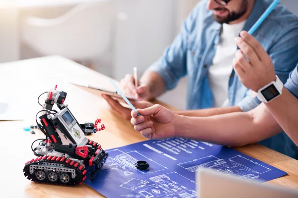 Pleasant colleagues sitting at the table — Stock Photo, Image