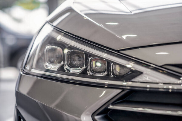 Close-up of new grey car front lights