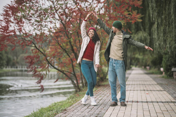 Man and woman enjoying their date near the river