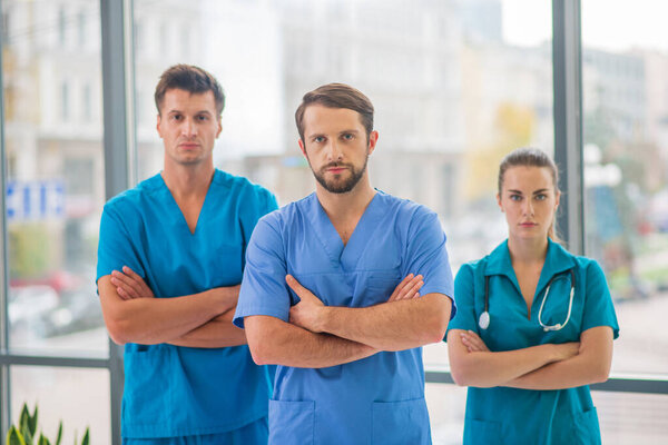 Group of doctors standing and looking determined