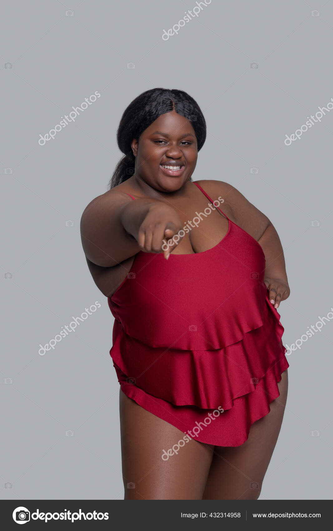 Happy plus size african american woman wearing - Stock Photo