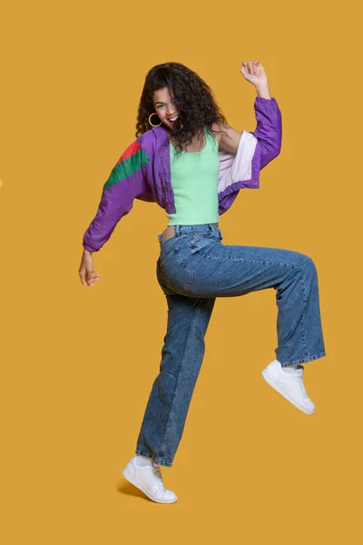 Pretty dark-haired young girl in bright jacket looking energetic — Stock Photo, Image