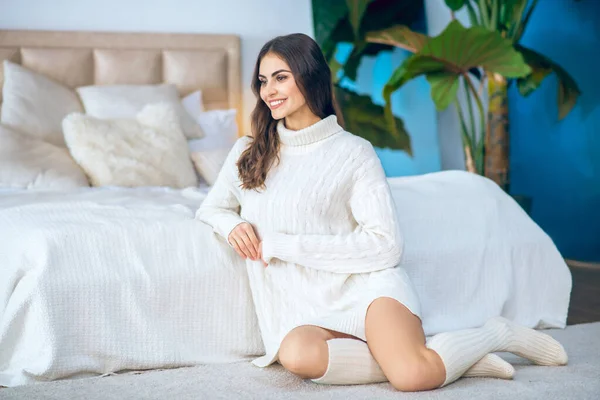 Young beautiful woman in white clothes spending time at home — Stock Photo, Image