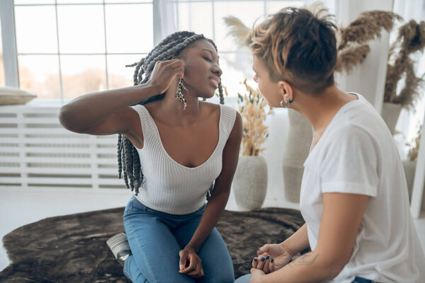 Girls spending time at home trying on some accessories