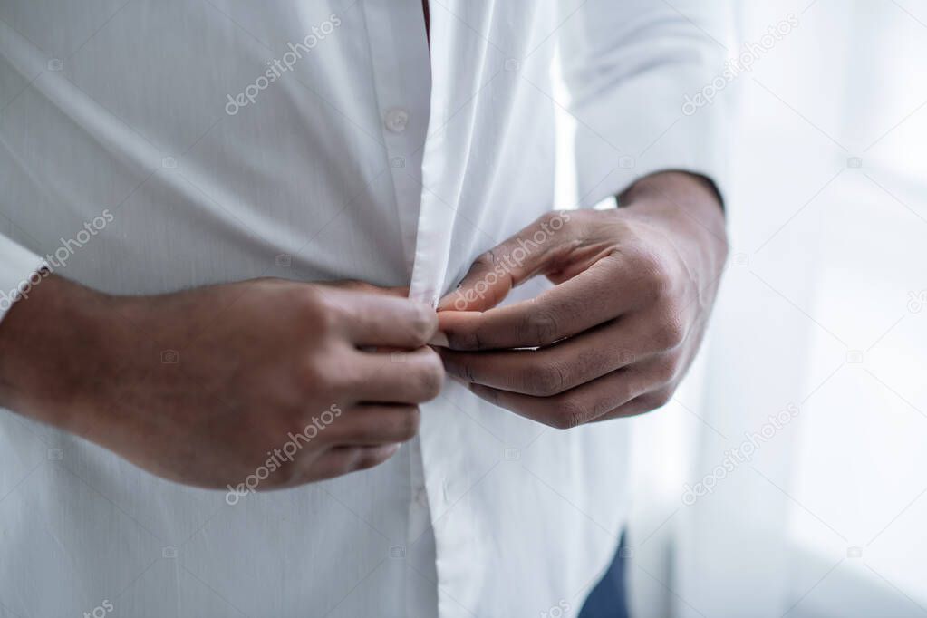 Close up of a man wearing a white shirt