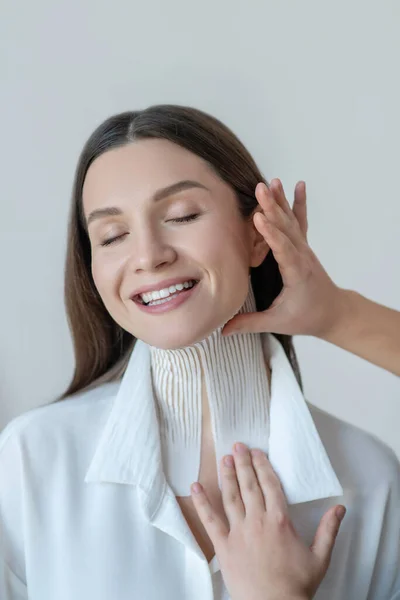 Cute young woman having taping procedures in beauty center — Stock Photo, Image