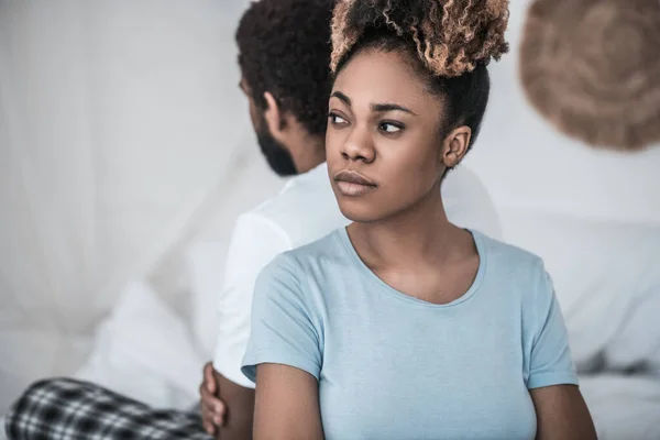 African American in depressed mood with back to husband — Stock Photo, Image