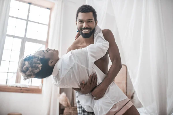 Man and woman in home clothes dancing — Stock Photo, Image