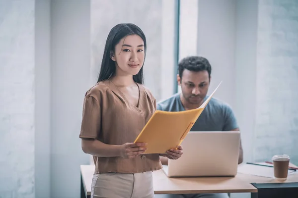 A chief and his assistant working in the office