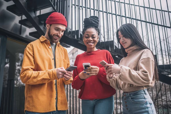 stock image Three friends spending time together online and looking excited