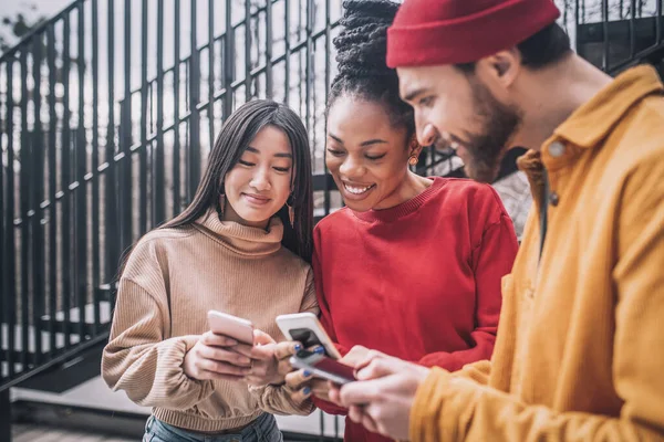 Three friends spending time together online and looking excited — Stock Photo, Image