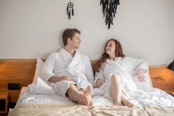 A couple lying in bed and looking peaceful — Stok fotoğraf