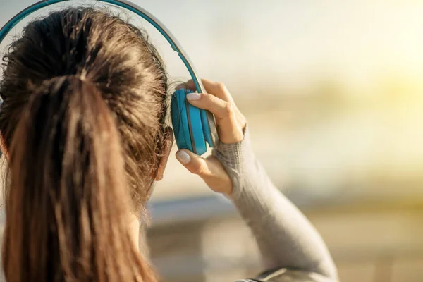 Close up of a girls head in headphones — Stock Photo, Image
