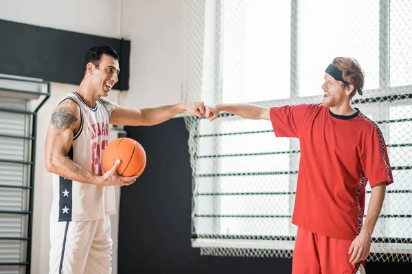 Two basketball players looking contented after the game — Stock Photo, Image