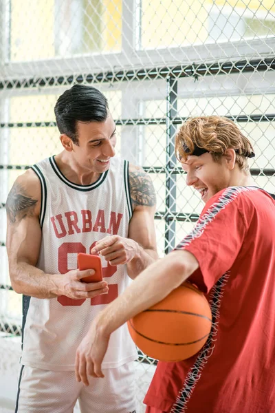 Two men in sportswear with a ball before the game — Photo