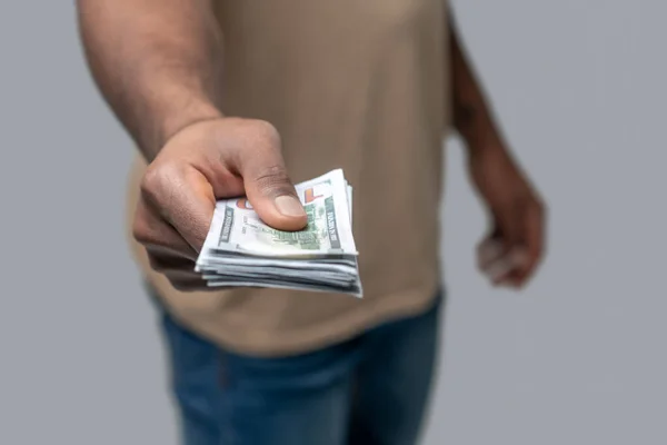 Close up picrture of a man holding money in his hands — Stock Photo, Image