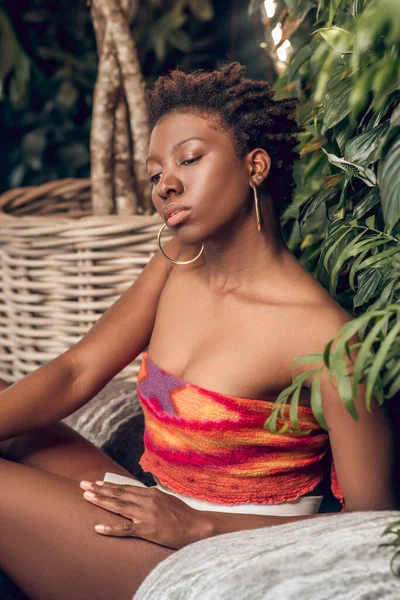 Pensive dark-skinned woman relaxing in spa — Stock Photo, Image