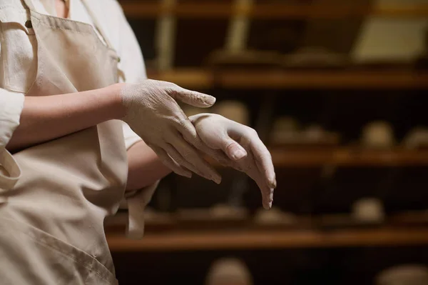 Close up of female potters hands in clay — Stock Photo, Image