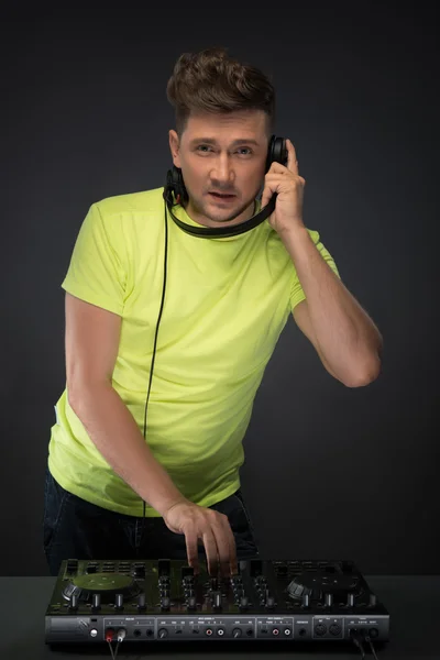 Dj at work isolated on dark grey background — Stock Photo, Image