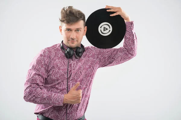 DJ posing with vinyl record and thumb up — Stock Photo, Image