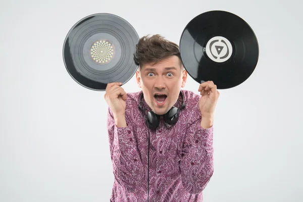 DJ having fun with vinyl record showing Mickey mouse ears — Stock Photo, Image