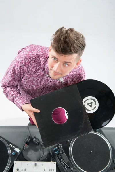 Top view portrait of dj showing his vinyl records standing by tu — Stock Photo, Image