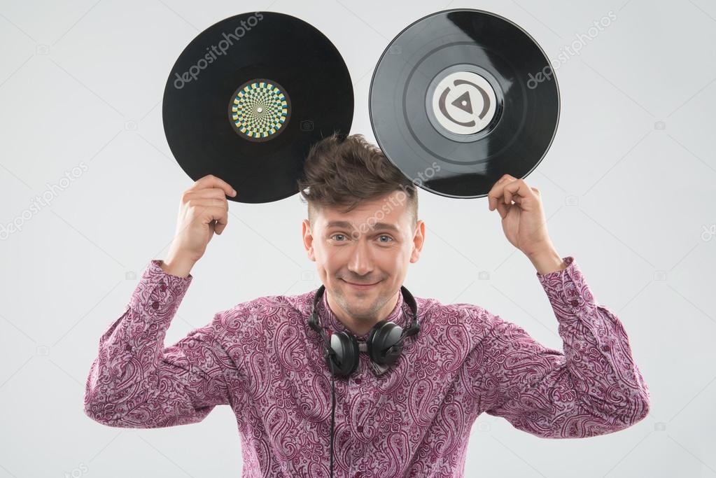 DJ having fun with vinyl record showing Mickey mouse ears