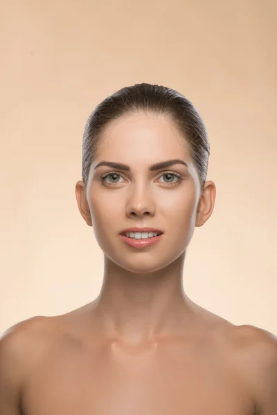 Young woman with beautiful healthy face - isolated on beige back — Stock Photo, Image