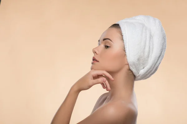 Portrait of girl with a towel on her head — Stock Photo, Image