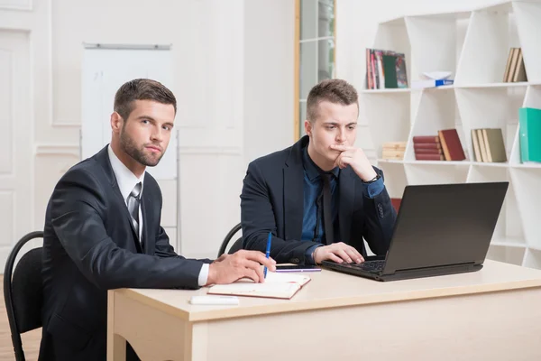 Businessmen in office working on some project — Stock Photo, Image