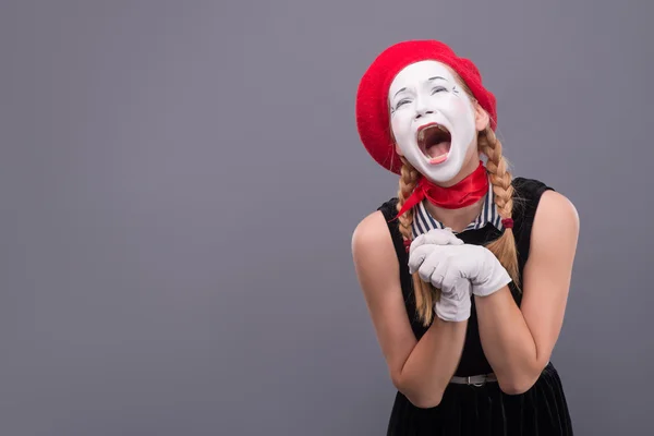 Portrait of female mime in red head and with white face isolated — Stock Photo, Image