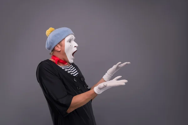 Portrait of male mime in red head and with white face isolated o — Stock Photo, Image