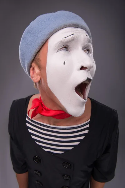 Portrait of male mime in red head and with white face isolated o — Stock Photo, Image
