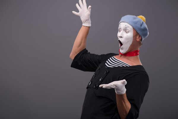 Portrait of male mime white funny face and emotions isolated on