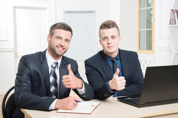 Two handsome businessmen in suits in office — Stock Photo, Image