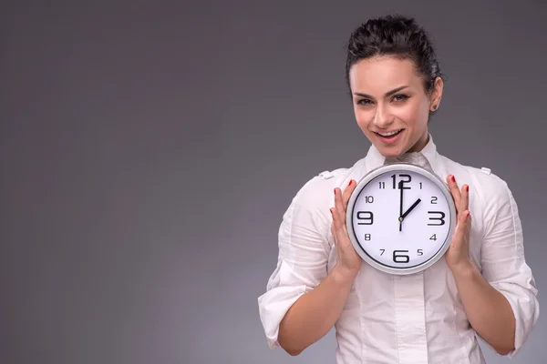 Girl holding big clock — Stock Photo, Image