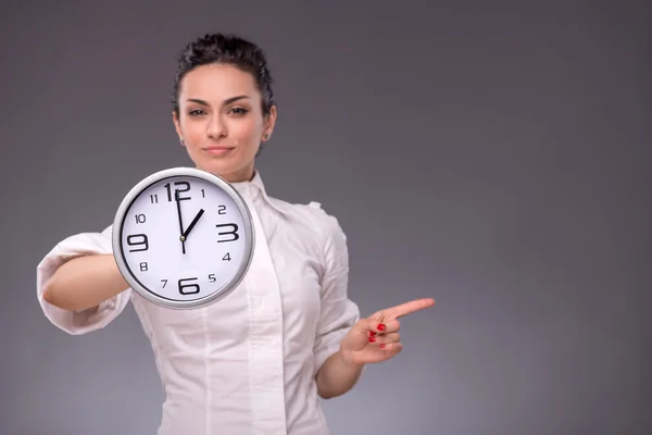 Girl holding big clock — Stock Photo, Image