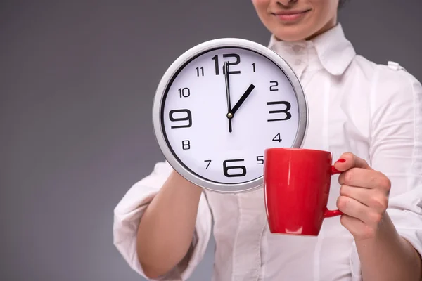 Portrait of girl holding a big clock — Stock Photo, Image