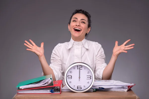 Waist-up portrait of young girl sitting at the table in office — Stock Photo, Image