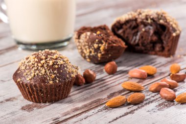 Close-up picture of chocolate cupcake with almonds and hazelnut clipart